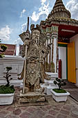 Bangkok Wat Pho, chinese style door guardians of the monumental gates of the outer walls of the temple compund. 